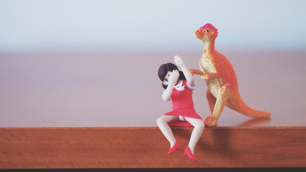 Prehistoric Photojojo toy dinosaur vs Fuchico on the Cup office girl figure