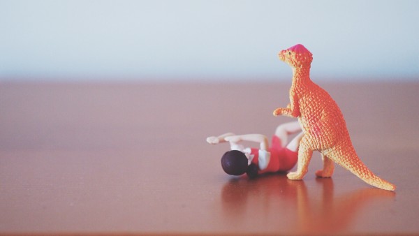 Prehistoric Photojojo toy dinosaur vs Fuchico on the Cup office girl figure